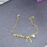 Μαρτυρικό Βραχιόλι Gold Bow - Νονά